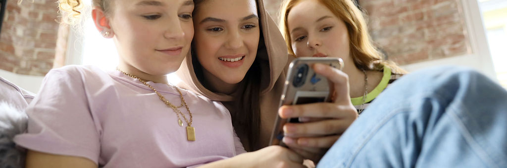 Friends sharing phone